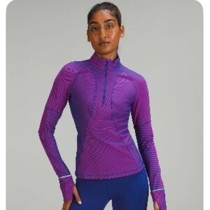 Lululemon Athletics -Tone Ribbed Running
Half Zip
Psychic/Sonic Pink
Size 6
